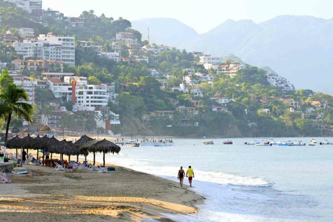 Puerto Vallarta beach during summer rainy season with palm trees